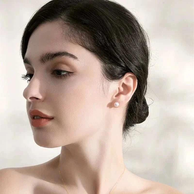 TIYINUO 18K Gold AU750 Natural Pearl Stud Earrings on model.