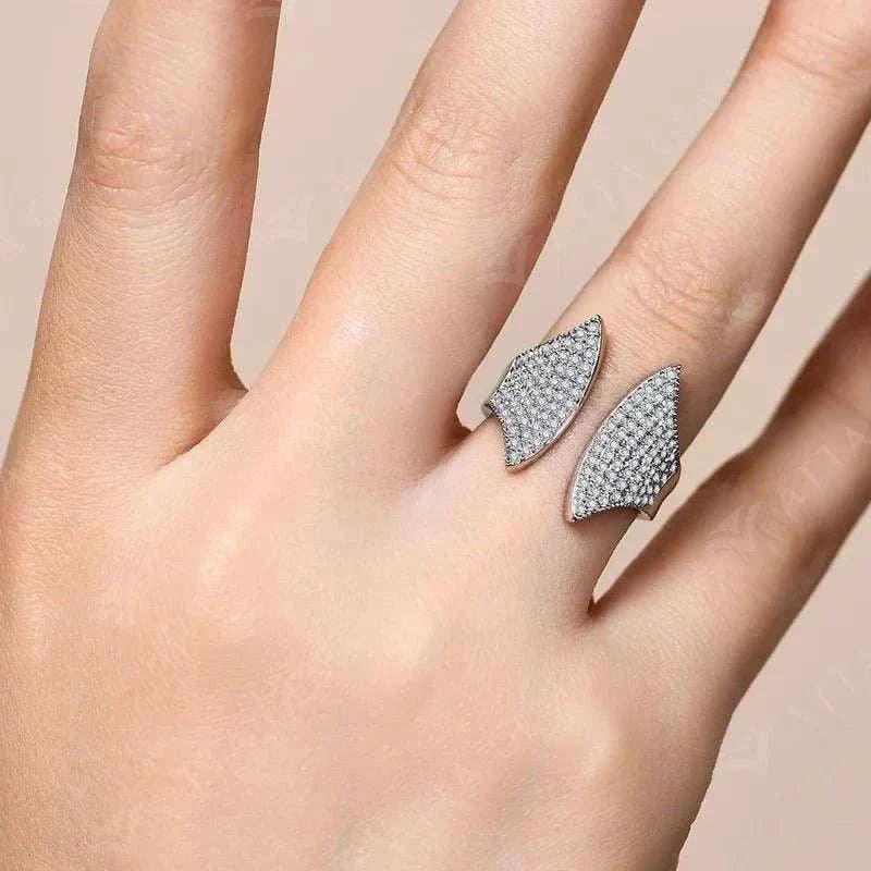 VVS1 moissanite adjustable ring in 18k white gold on hand.